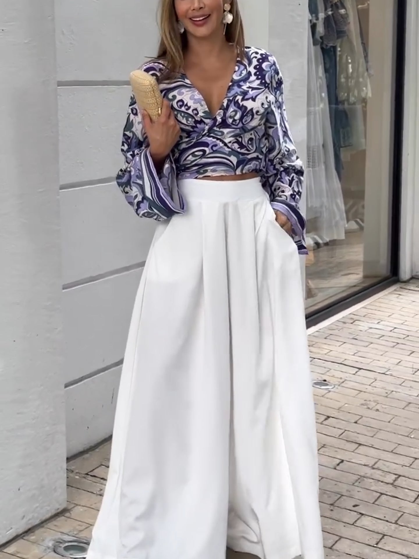 Purple printed top and white loose pants suits