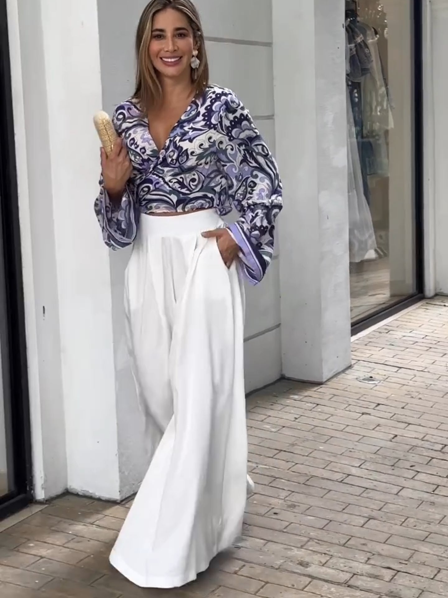 Purple printed top and white loose pants suits