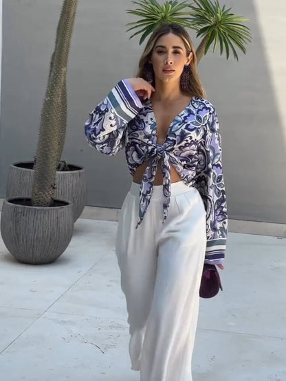 Purple printed top and white loose pants suits